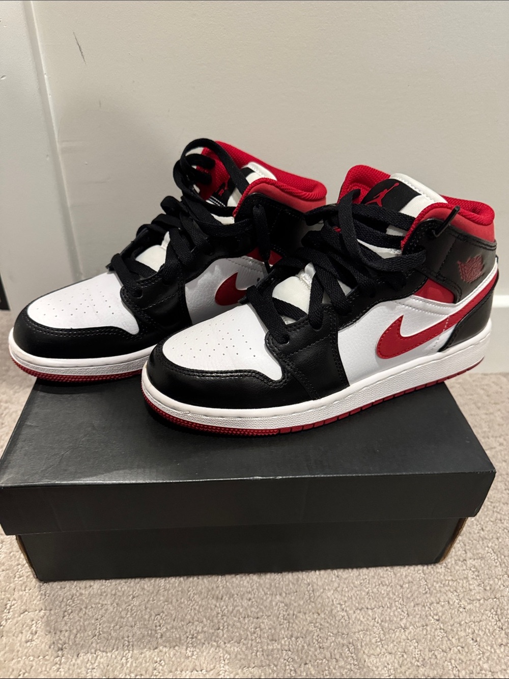 Nike Air Jordan 1 Mid in White, Black & Red